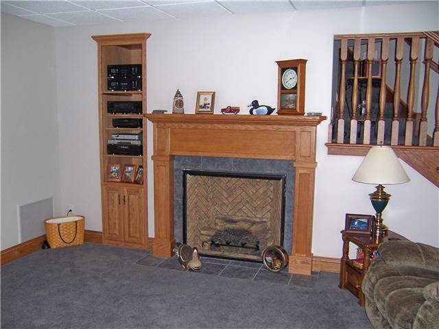 Fireplace mantel/Built-in bookshelves/storage - stained oak